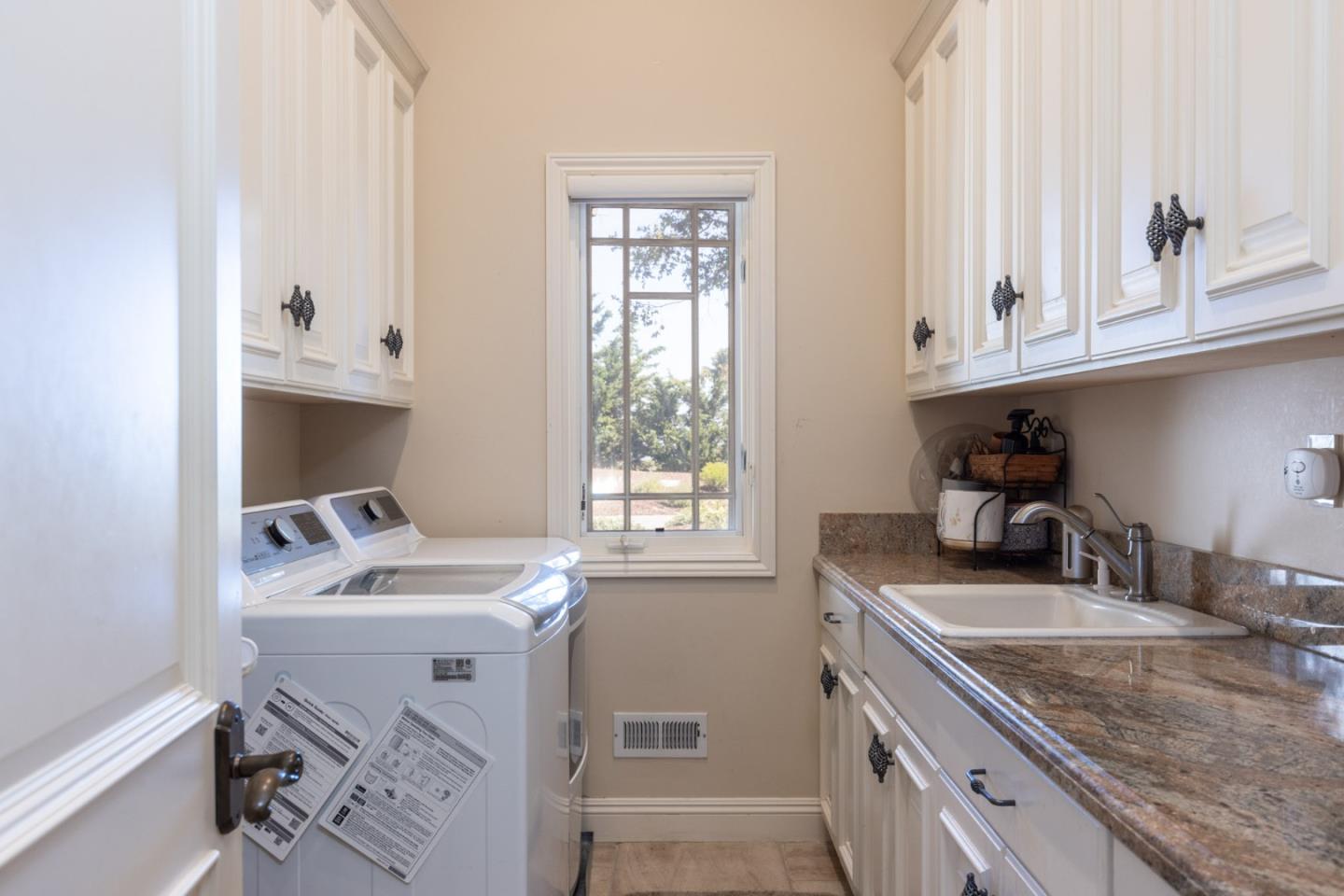 19831 Spring Ridge Terrace Salinas, CA 93908 - Photo 31 of 49 a kitchen with a sink cabinets and a window