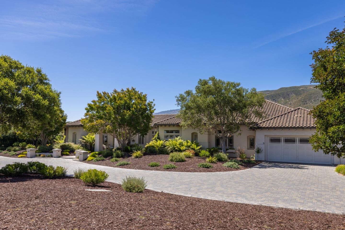 19831 Spring Ridge Terrace Salinas, CA 93908 - Photo 4 of 49 a front view of a house with a yard and a garage