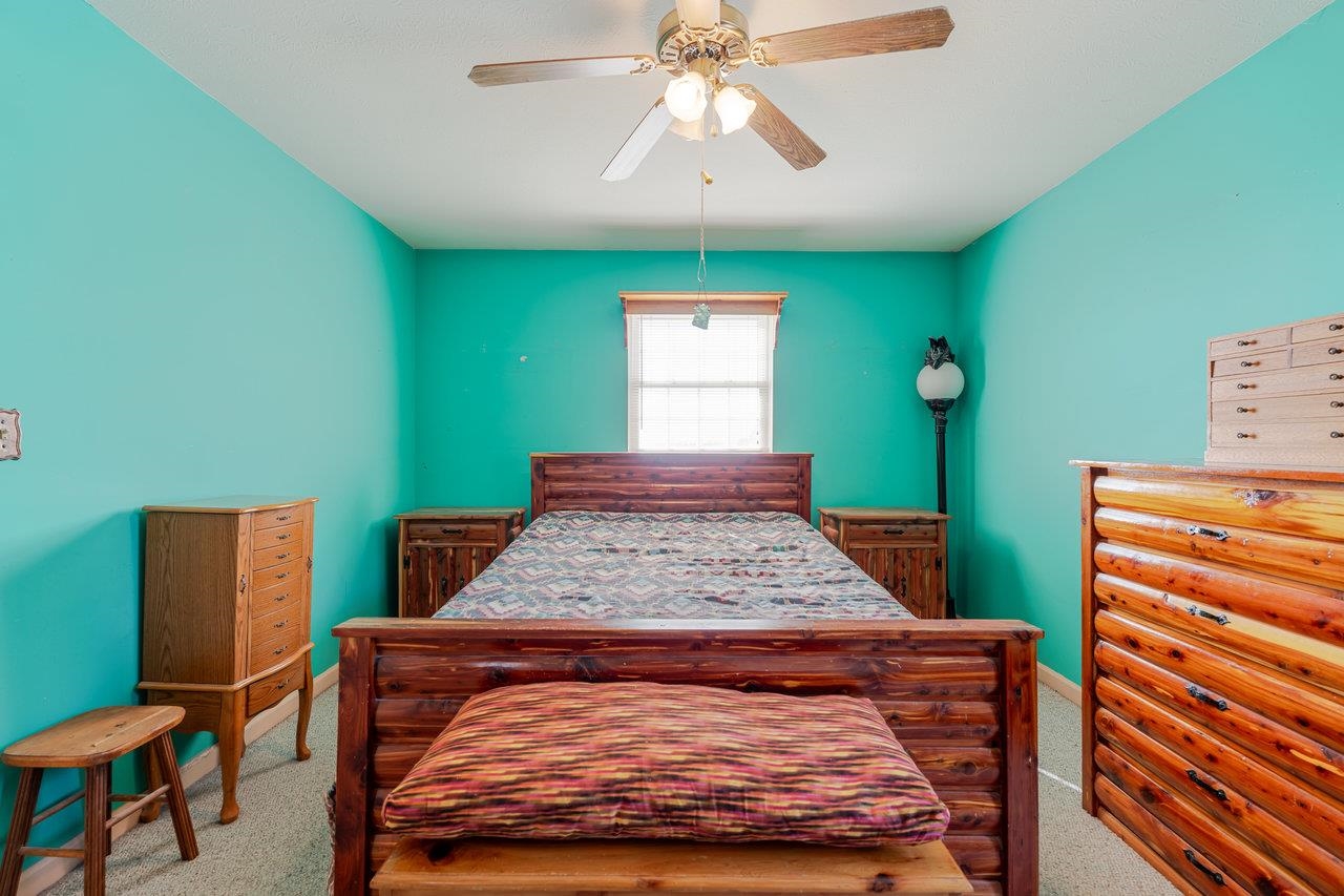 107 Orchard Road Staunton, VA 24401 - Photo 14 of 44 a bedroom with a bed and a dresser in it