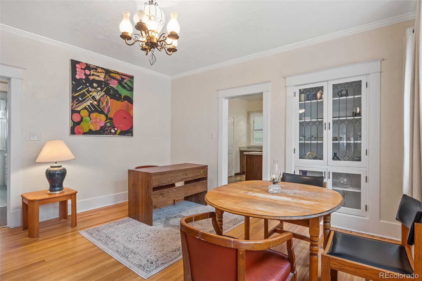 6044 Columbine Street Rye, CO 81069 - Photo 12 of 31 a view of a dining room with furniture window and wooden floor