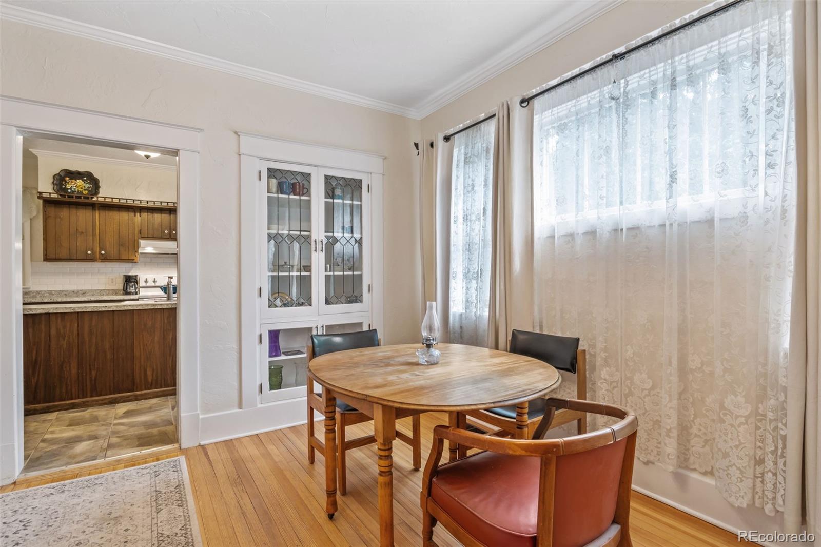 6044 Columbine Street Rye, CO 81069 - Photo 13 of 31 a view of a dining room with furniture window and wooden floor