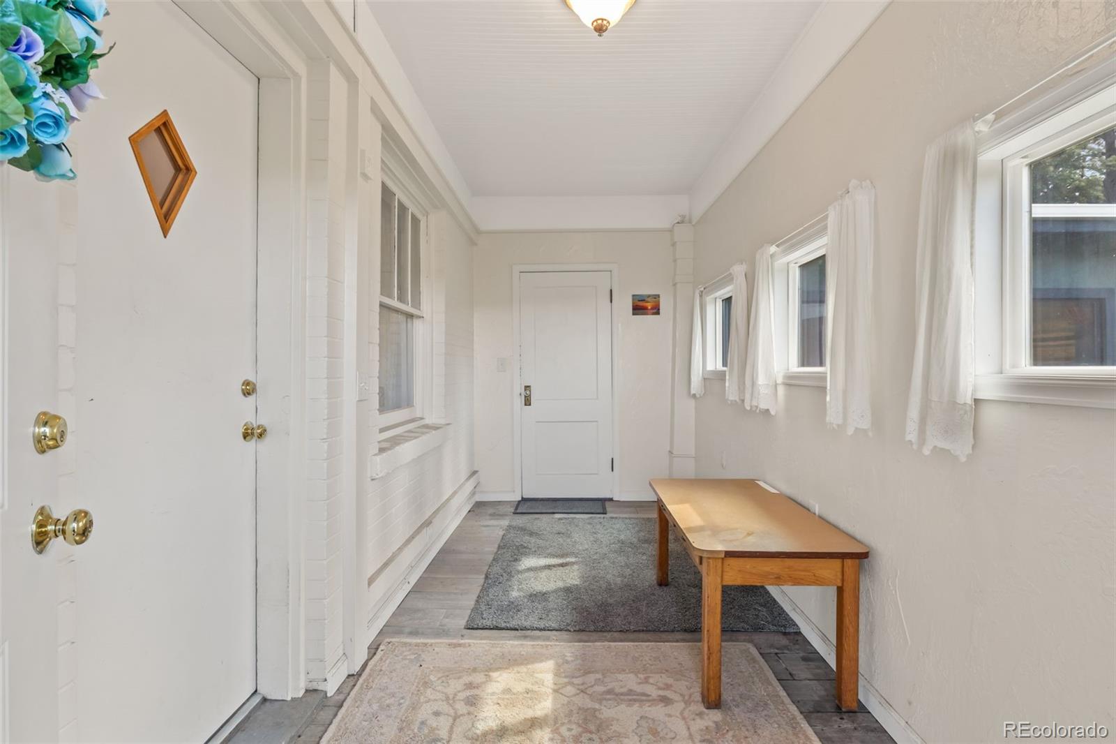 6044 Columbine Street Rye, CO 81069 - Photo 19 of 31 a view of an entryway with wooden floor