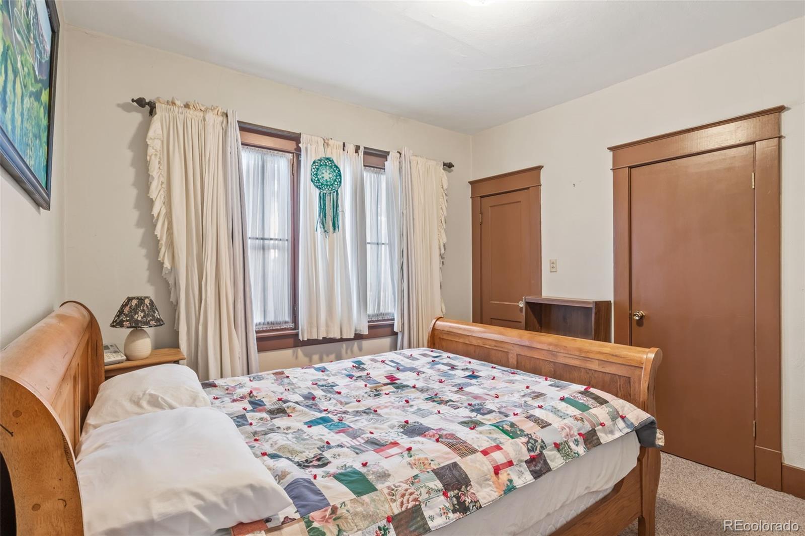 6044 Columbine Street Rye, CO 81069 - Photo 20 of 31 a bedroom with a bed and a window