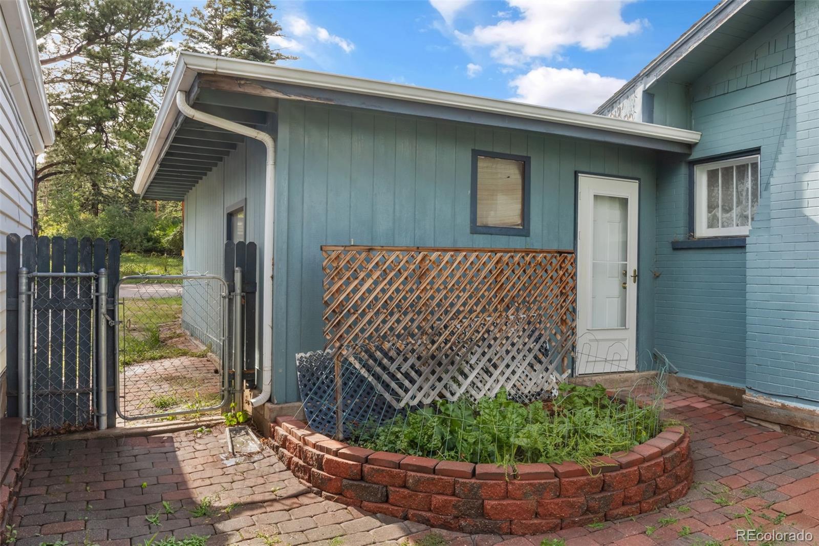 6044 Columbine Street Rye, CO 81069 - Photo 27 of 31 a view of a wooden door of a house