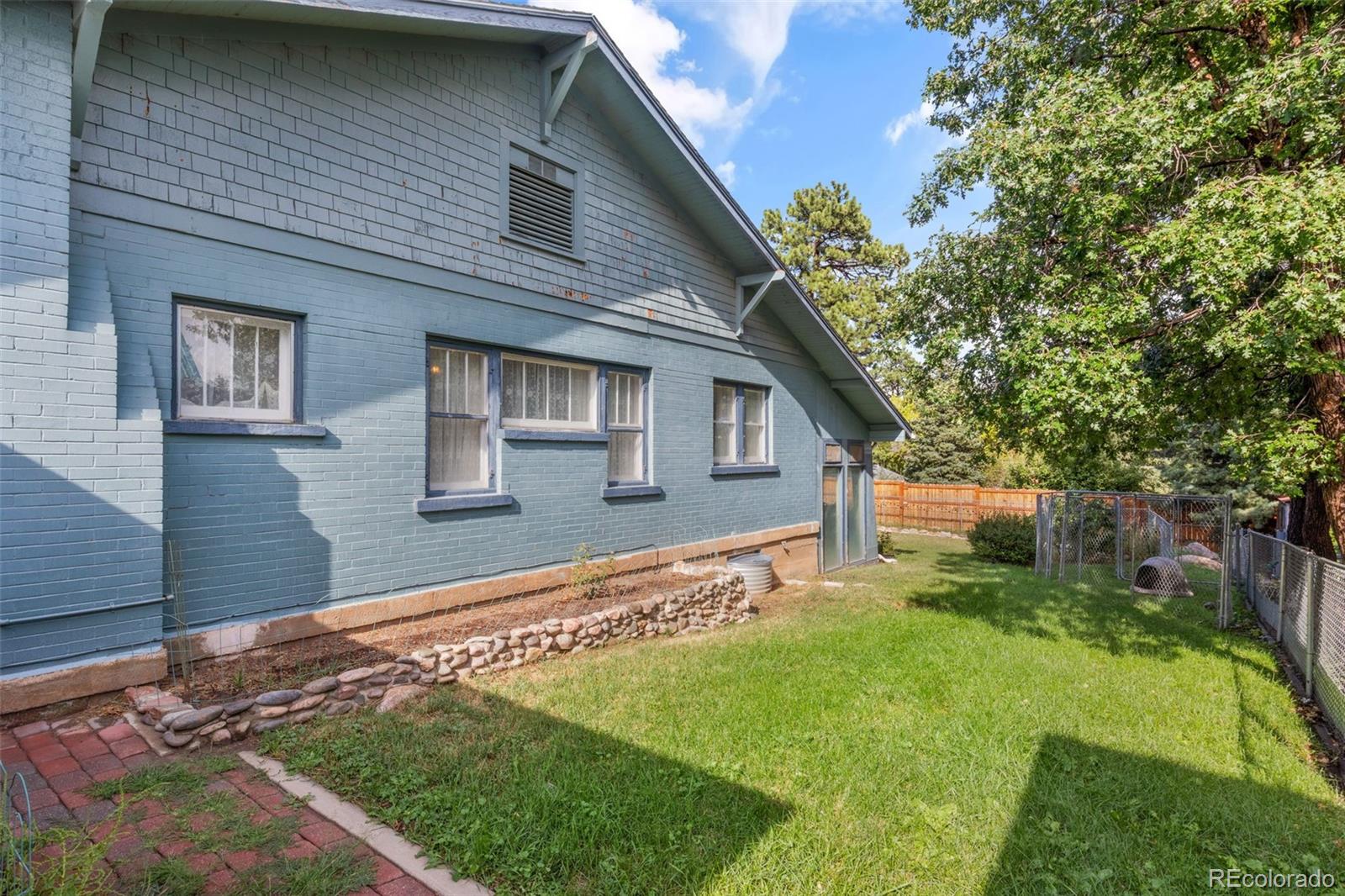 6044 Columbine Street Rye, CO 81069 - Photo 28 of 31 a front view of a house with garden