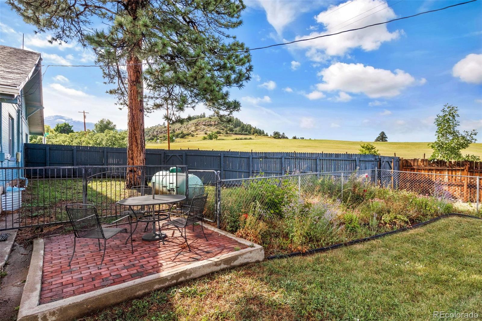 6044 Columbine Street Rye, CO 81069 - Photo 4 of 31 a view of a swimming pool with a patio