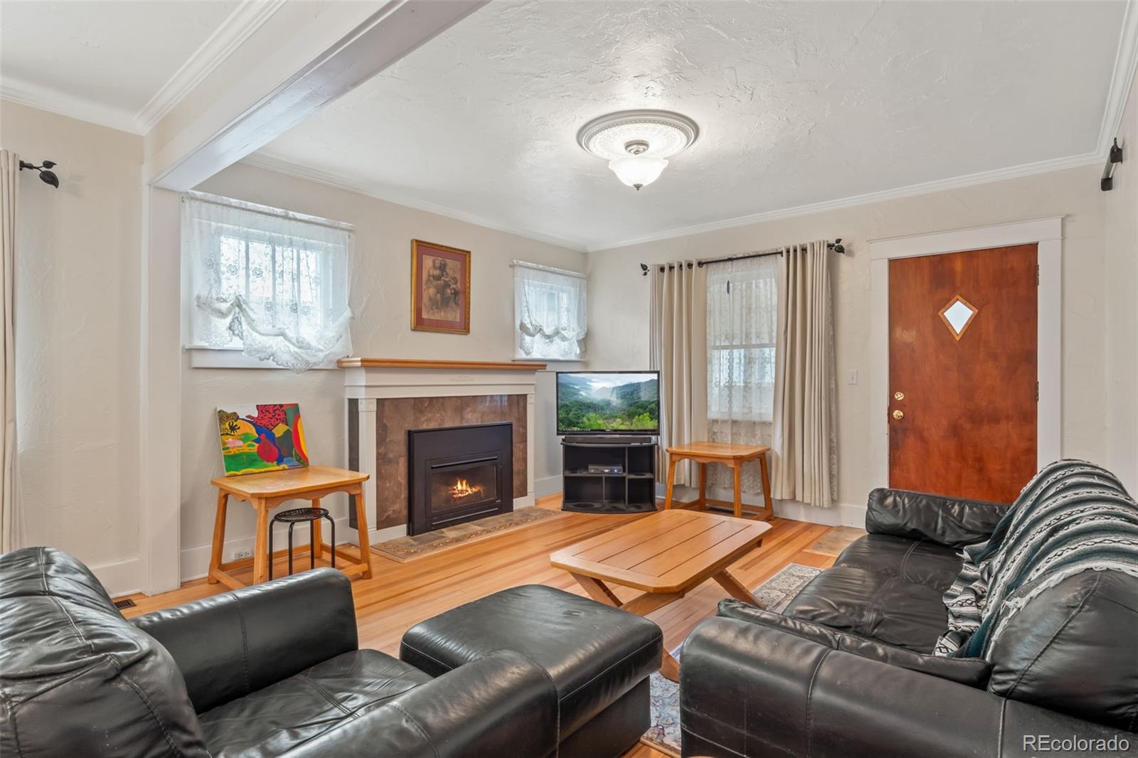 6044 Columbine Street Rye, CO 81069 - Photo 8 of 31 a living room with furniture and a fireplace