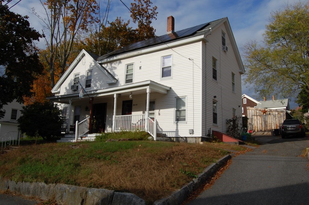33 1/2 High Street Ware, MA 01082 - Photo 1 of 22 a view of a white house next to a yard with big trees