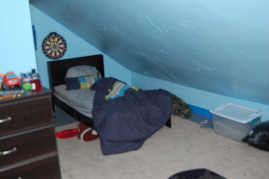 33 1/2 High Street Ware, MA 01082 - Photo 13 of 22 a living room with furniture and a chair