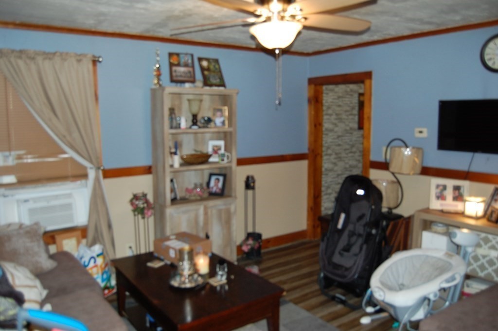 33 1/2 High Street Ware, MA 01082 - Photo 16 of 22 a living room with furniture a flat screen tv and kitchen view