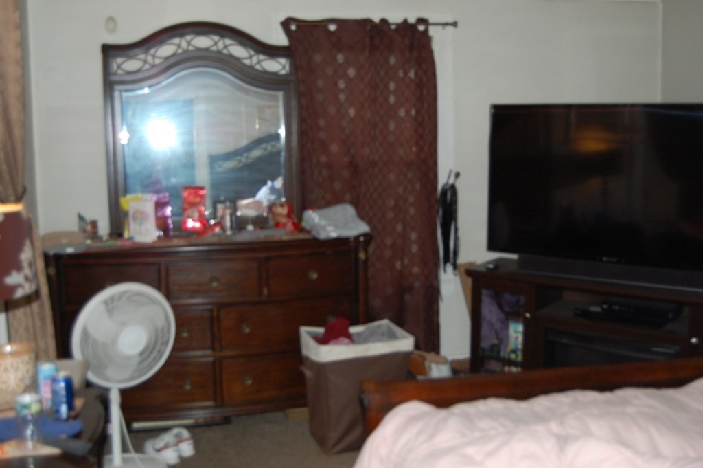 33 1/2 High Street Ware, MA 01082 - Photo 18 of 22 a living room with a mirror and a flat screen tv