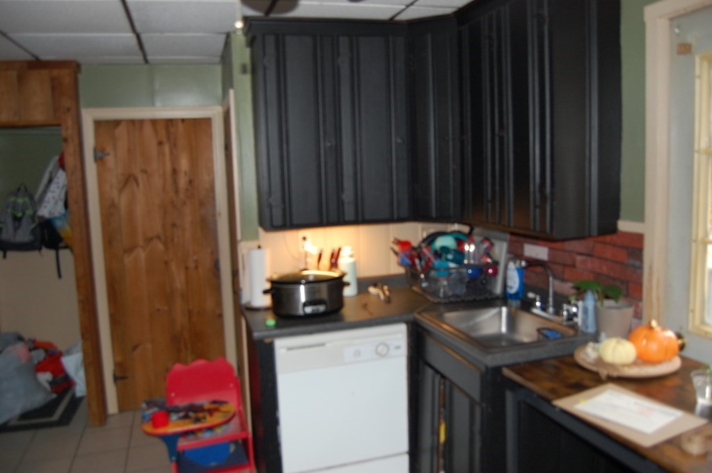 33 1/2 High Street Ware, MA 01082 - Photo 6 of 22 a kitchen with a sink and cabinets