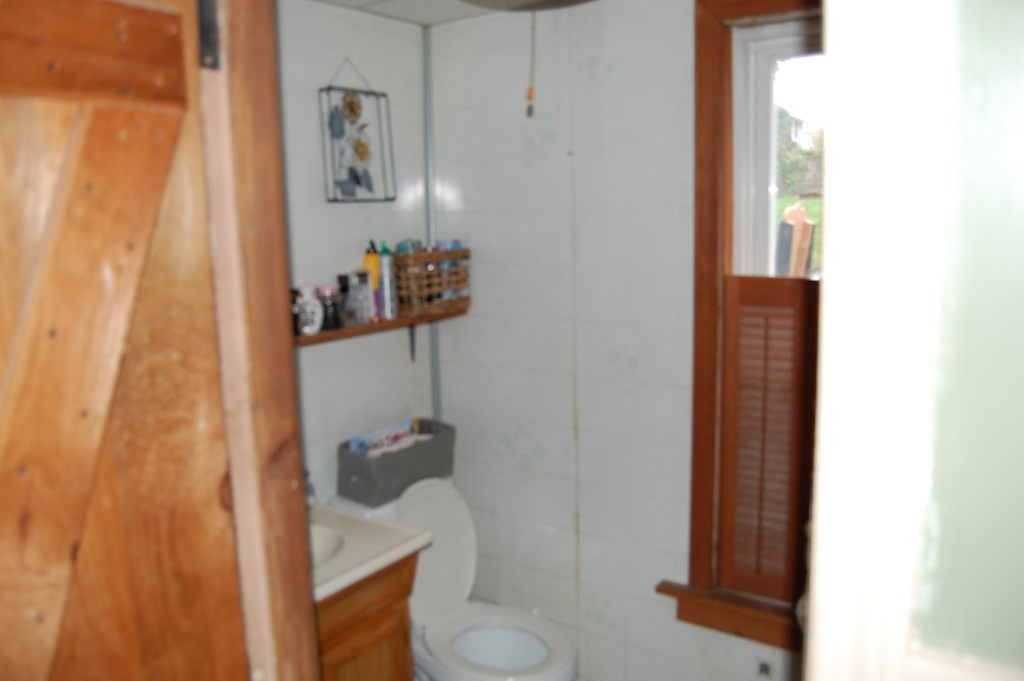 33 1/2 High Street Ware, MA 01082 - Photo 9 of 22 a bathroom with a toilet and a shower