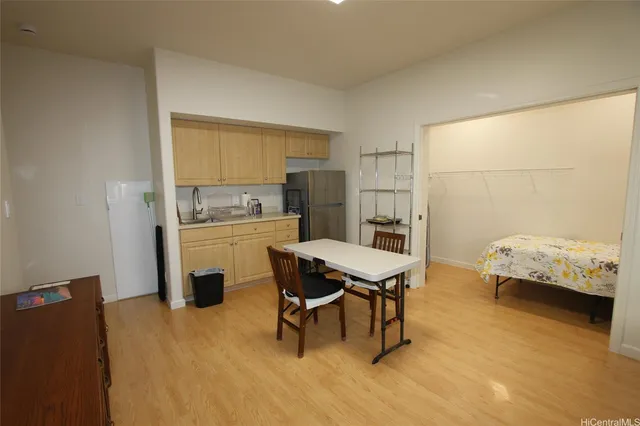 a kitchen with a table and chairs in it