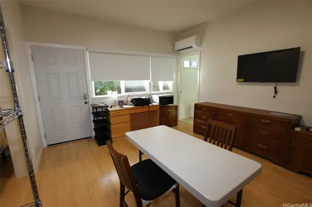 a kitchen with a refrigerator and a table