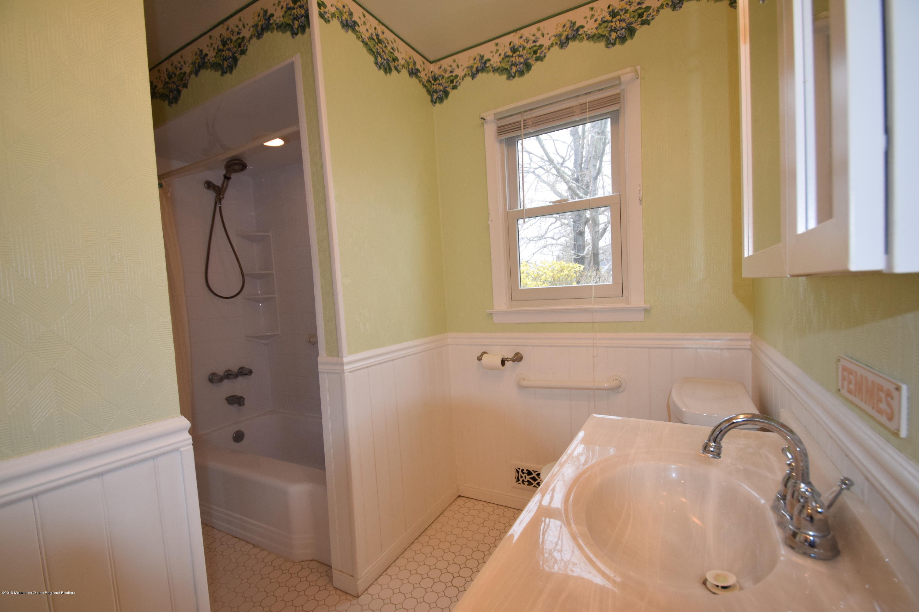 1519 Treeneedle Road Point Pleasant, NJ 08742 - Photo 8 of 21 a bathroom with a tub sink vanity and window