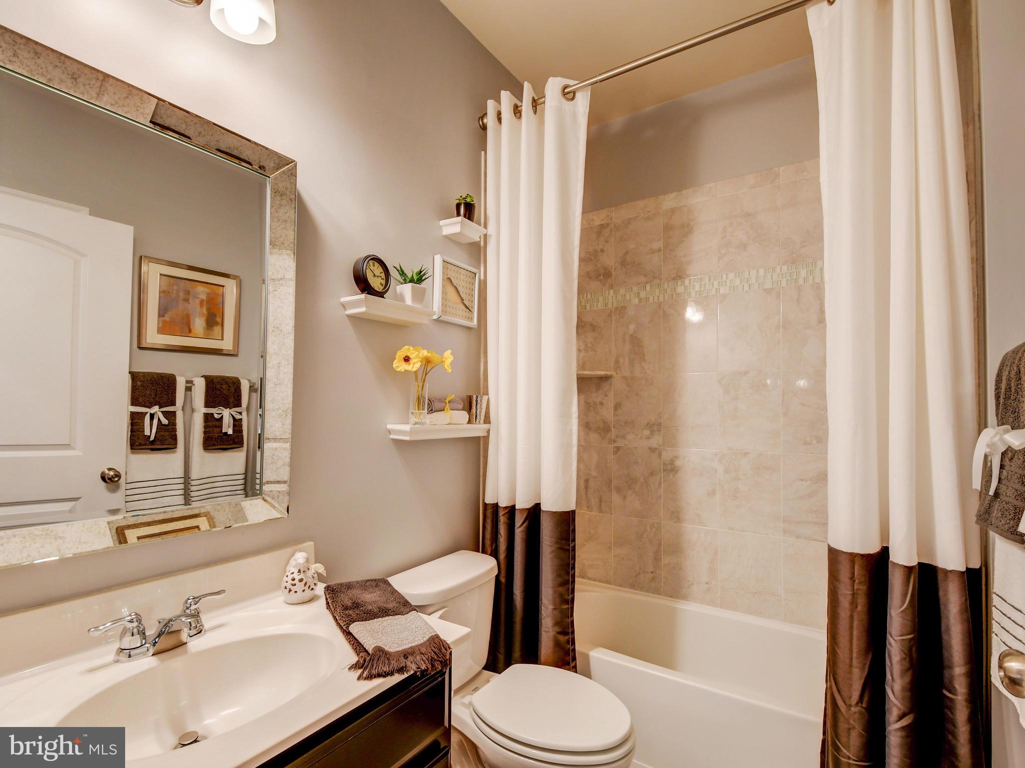 8137 Ridgely Loop Severn, MD 21144 - Photo 13 of 38 First Level Bathroom