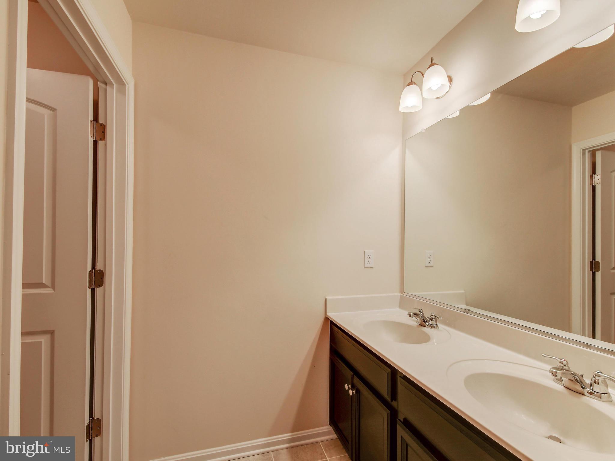 8137 Ridgely Loop Severn, MD 21144 - Photo 29 of 38 Upper Level Bathroom