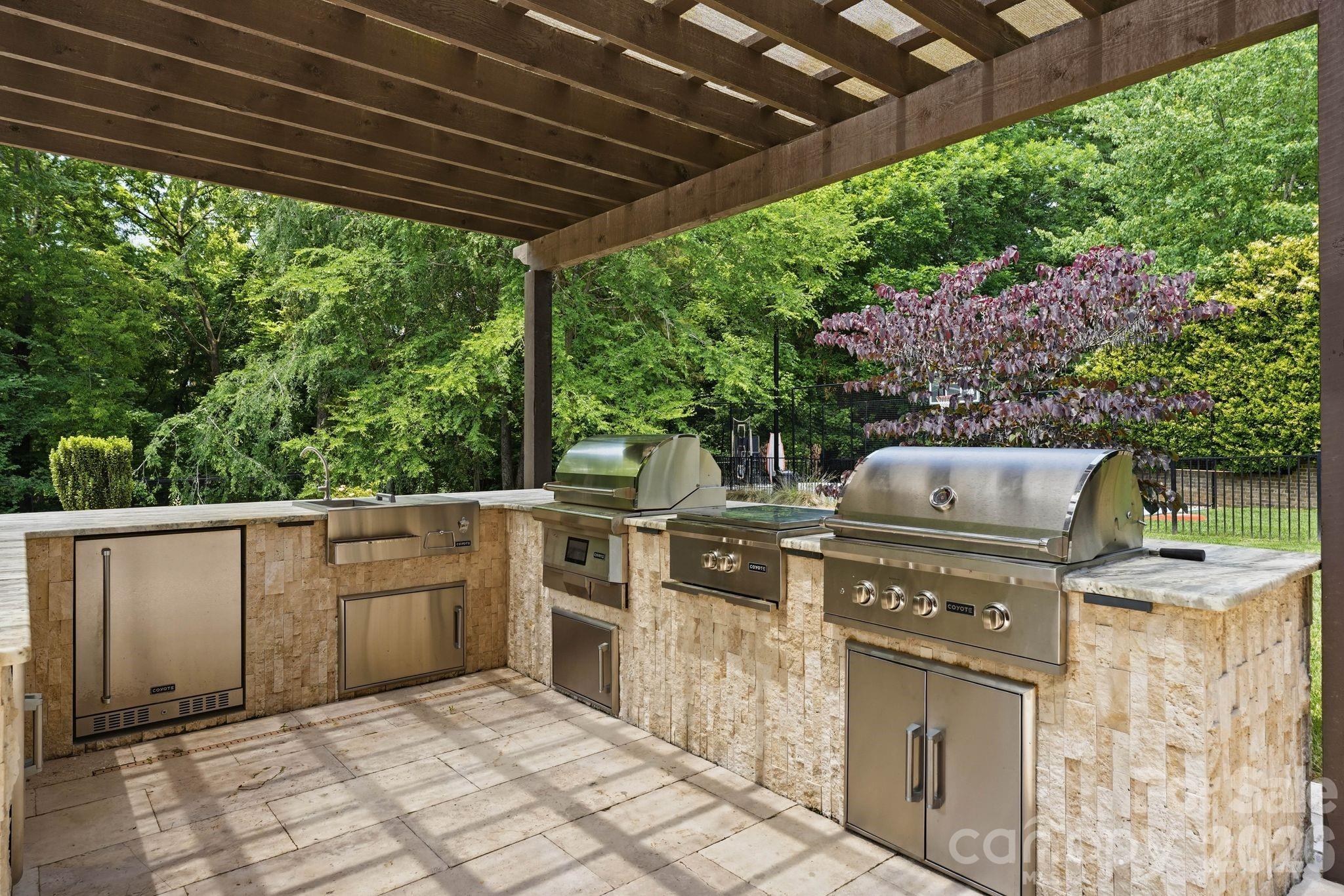 7416 Lee Rea Road Charlotte, NC 28226 - Photo 14 of 48 a view of a backyard with open kitchen