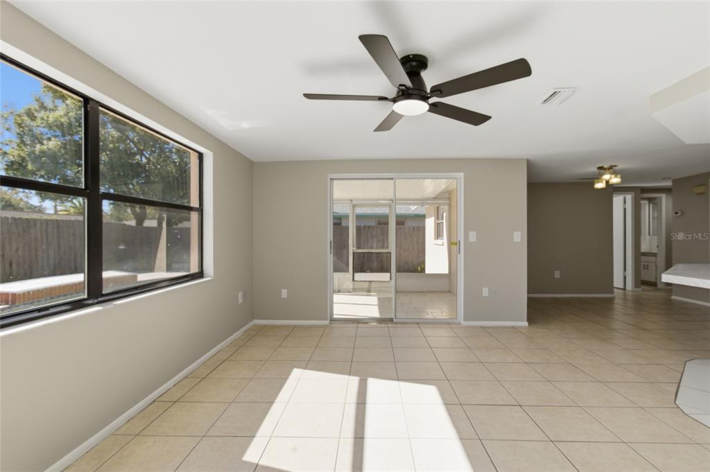 7230 San Moritz Drive Port Richey, FL 34668 - Photo 13 of 25 a view of a livingroom with a ceiling fan and window