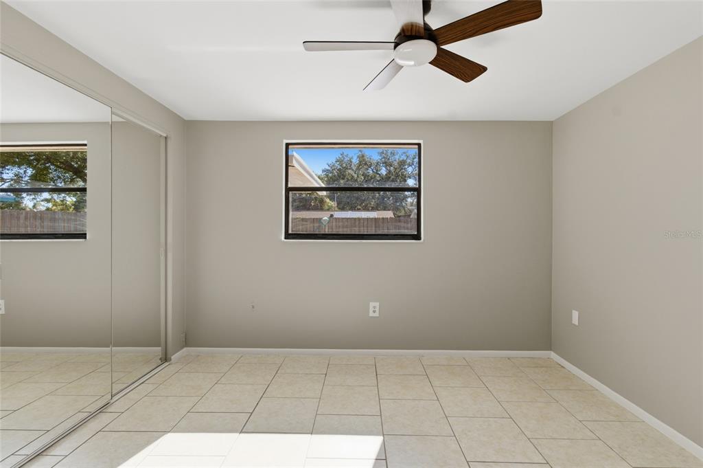 7230 San Moritz Drive Port Richey, FL 34668 - Photo 15 of 25 a view of an empty room with a window and a painting on the wall