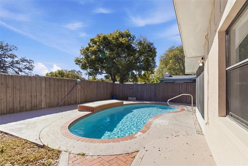 7230 San Moritz Drive Port Richey, FL 34668 - Photo 23 of 25 a backyard of a house with lots of green space