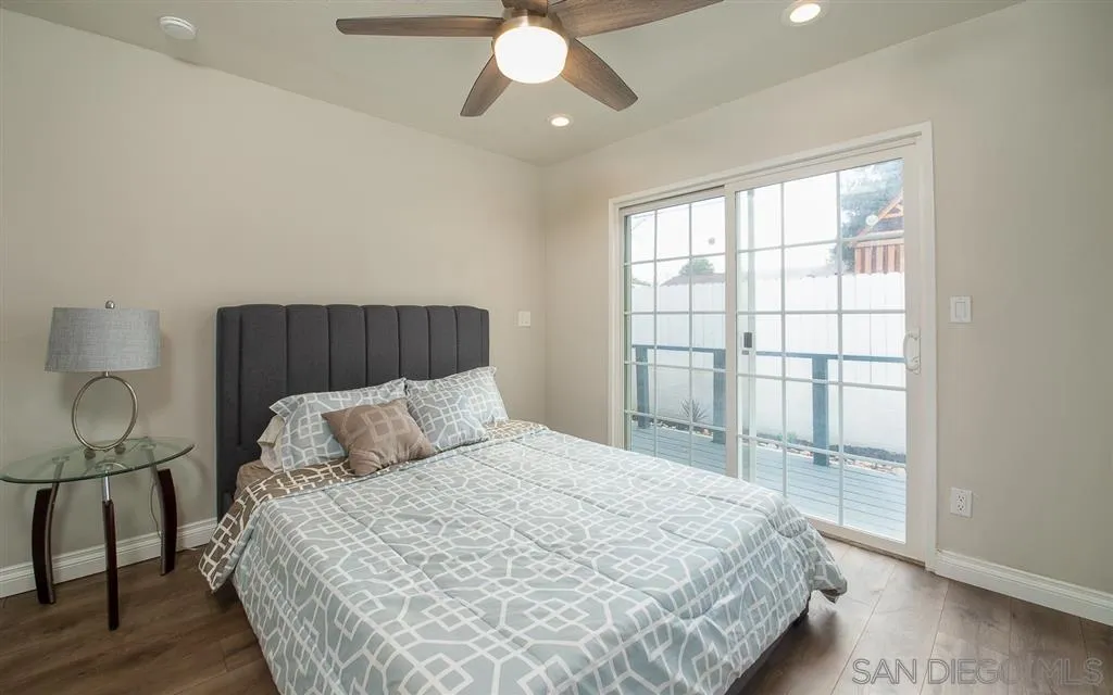 14356 Poway Road Poway, CA 92064 - Photo 14 of 25 a bedroom with a large bed and a window