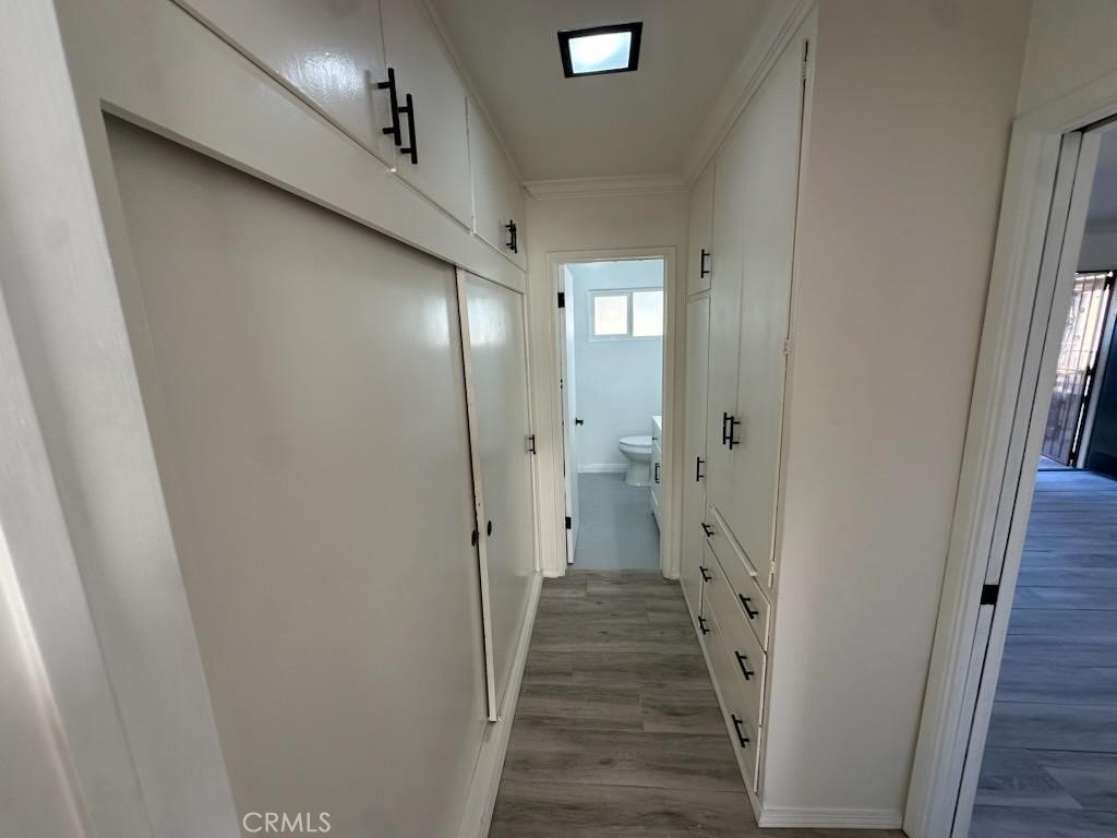 527 Cedar Avenue, Unit 2C Long Beach, CA 90802 - Photo 11 of 29 a view of a hallway with wooden floor and staircase