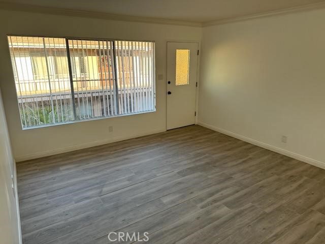 527 Cedar Avenue, Unit 2C Long Beach, CA 90802 - Photo 25 of 29 wooden floor in an empty room with a window