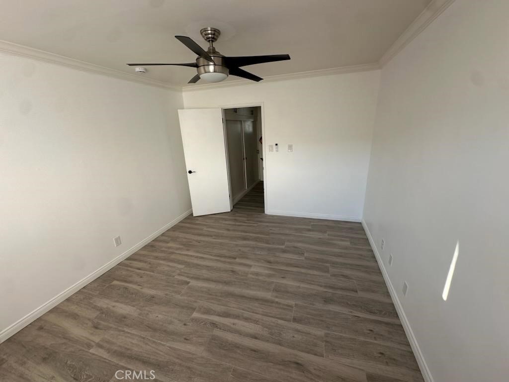 527 Cedar Avenue, Unit 2C Long Beach, CA 90802 - Photo 9 of 29 a view of a hallway with wooden floor
