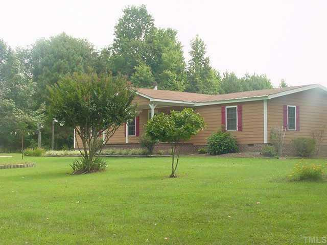 1028 Norris Road Clayton, NC 27520 - Photo 1 of 1 Private setting for a very well kept and updated double wide manufactured home. Over 2.4 acres unrestricted with boat/RV parking and barn with shelters Exterior Front