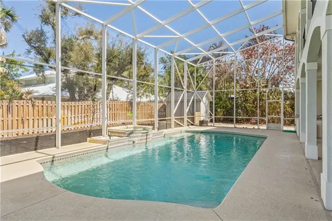 a view of swimming pool with outdoor seating