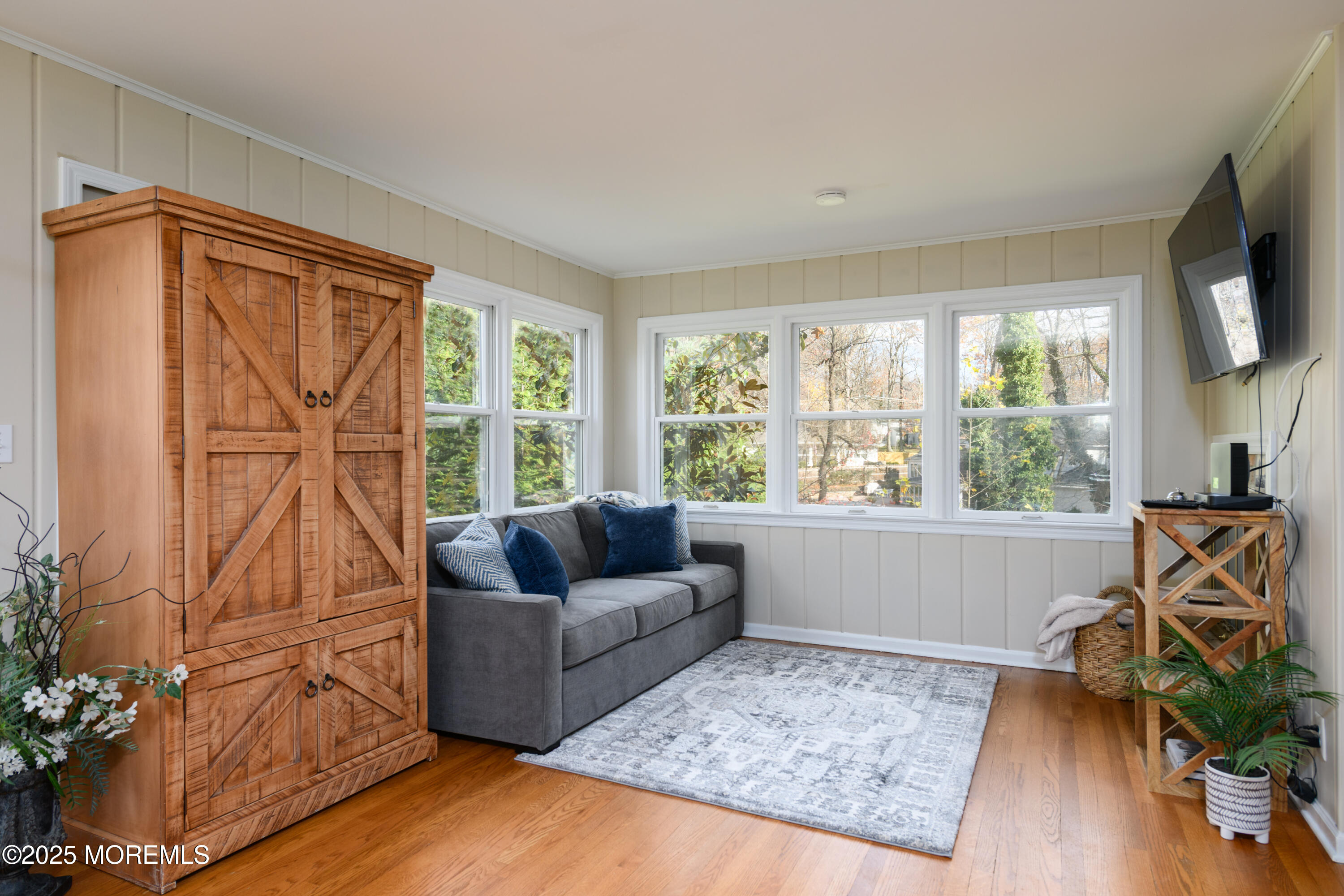 74 Fish Hawk Drive Middletown, NJ 07748 - Photo 11 of 32 a living room with furniture and a flat screen tv