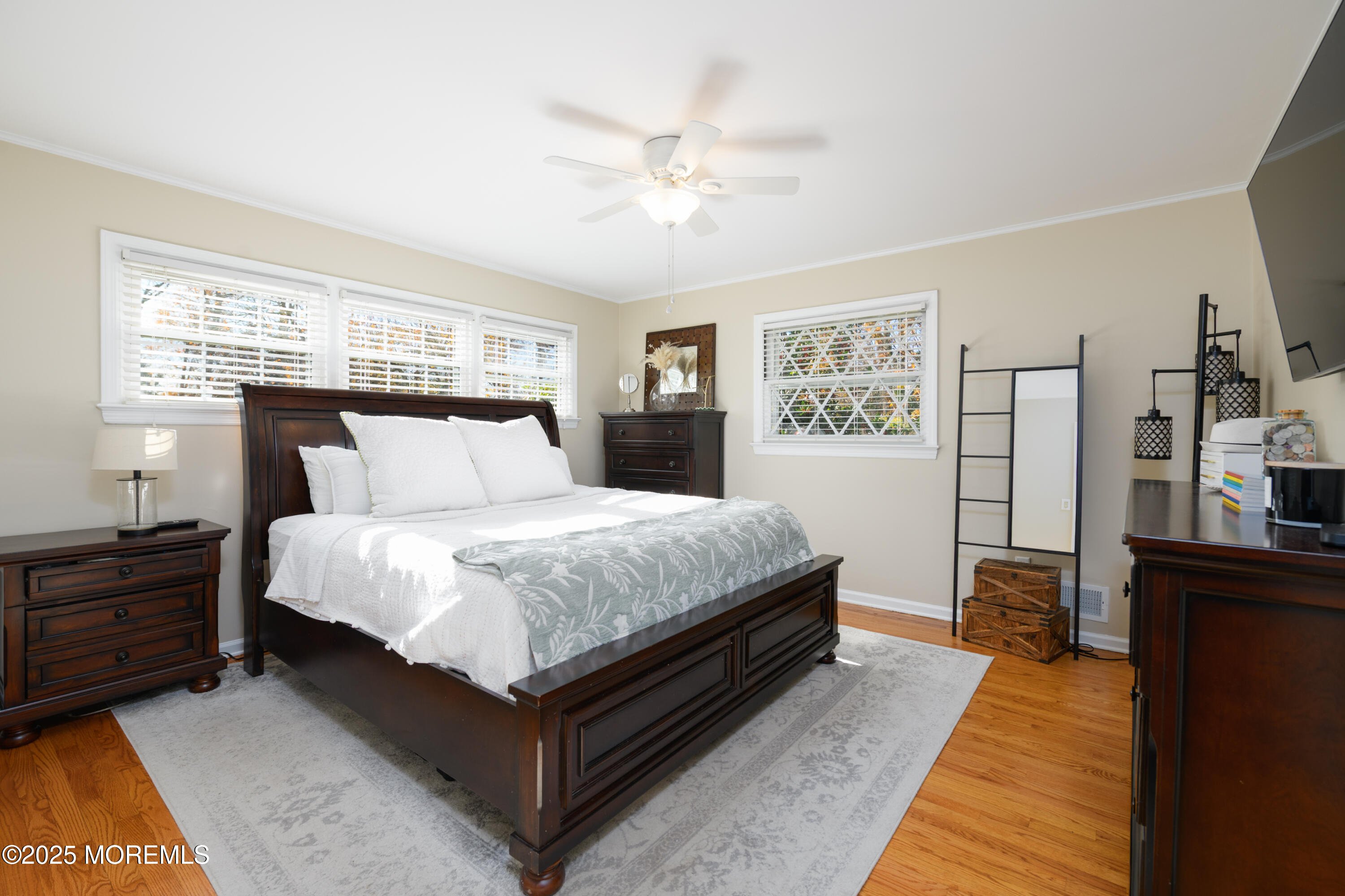 74 Fish Hawk Drive Middletown, NJ 07748 - Photo 13 of 32 a bedroom with a bed and wooden floor