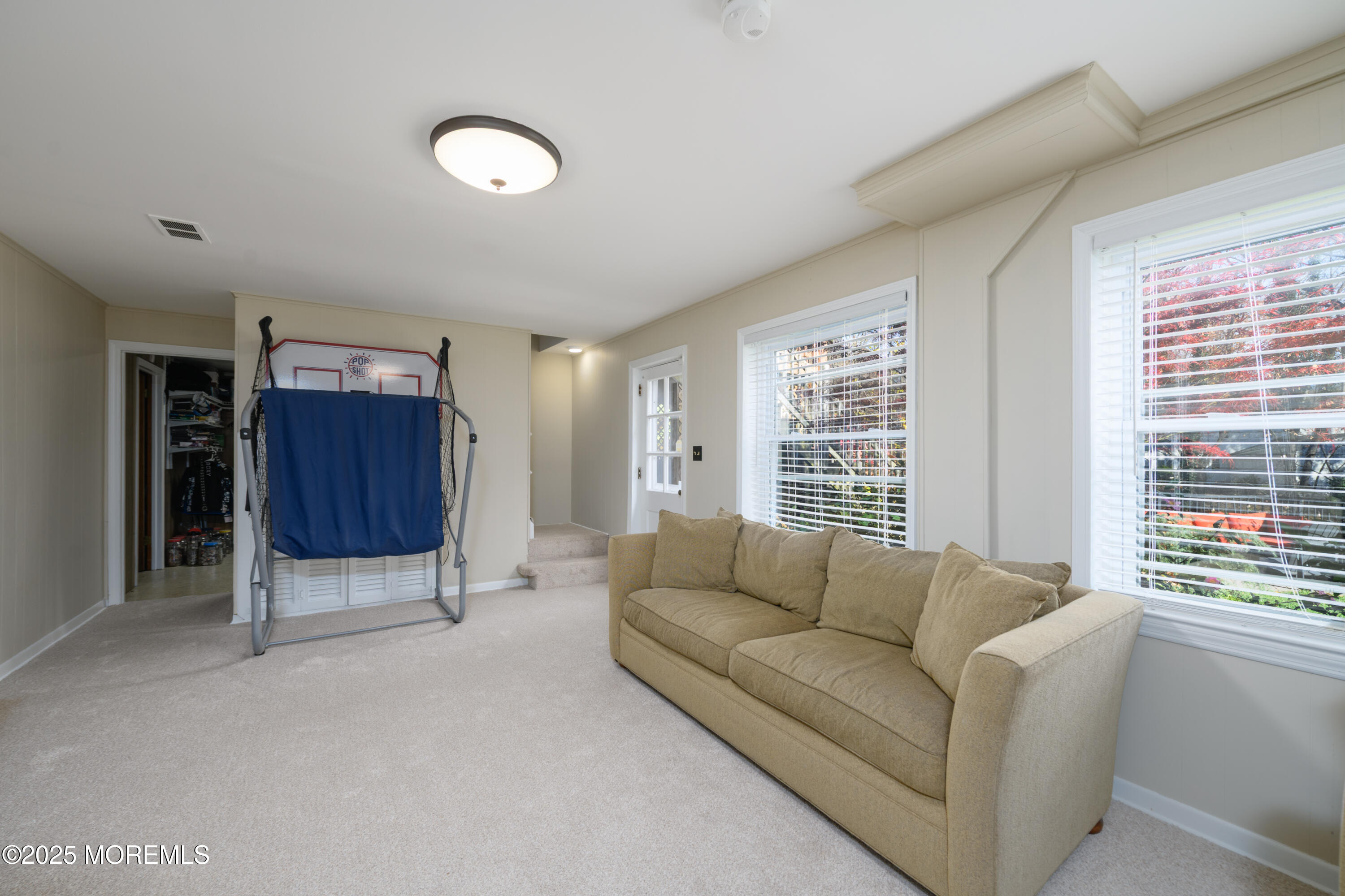 74 Fish Hawk Drive Middletown, NJ 07748 - Photo 18 of 32 a living room with furniture and a window
