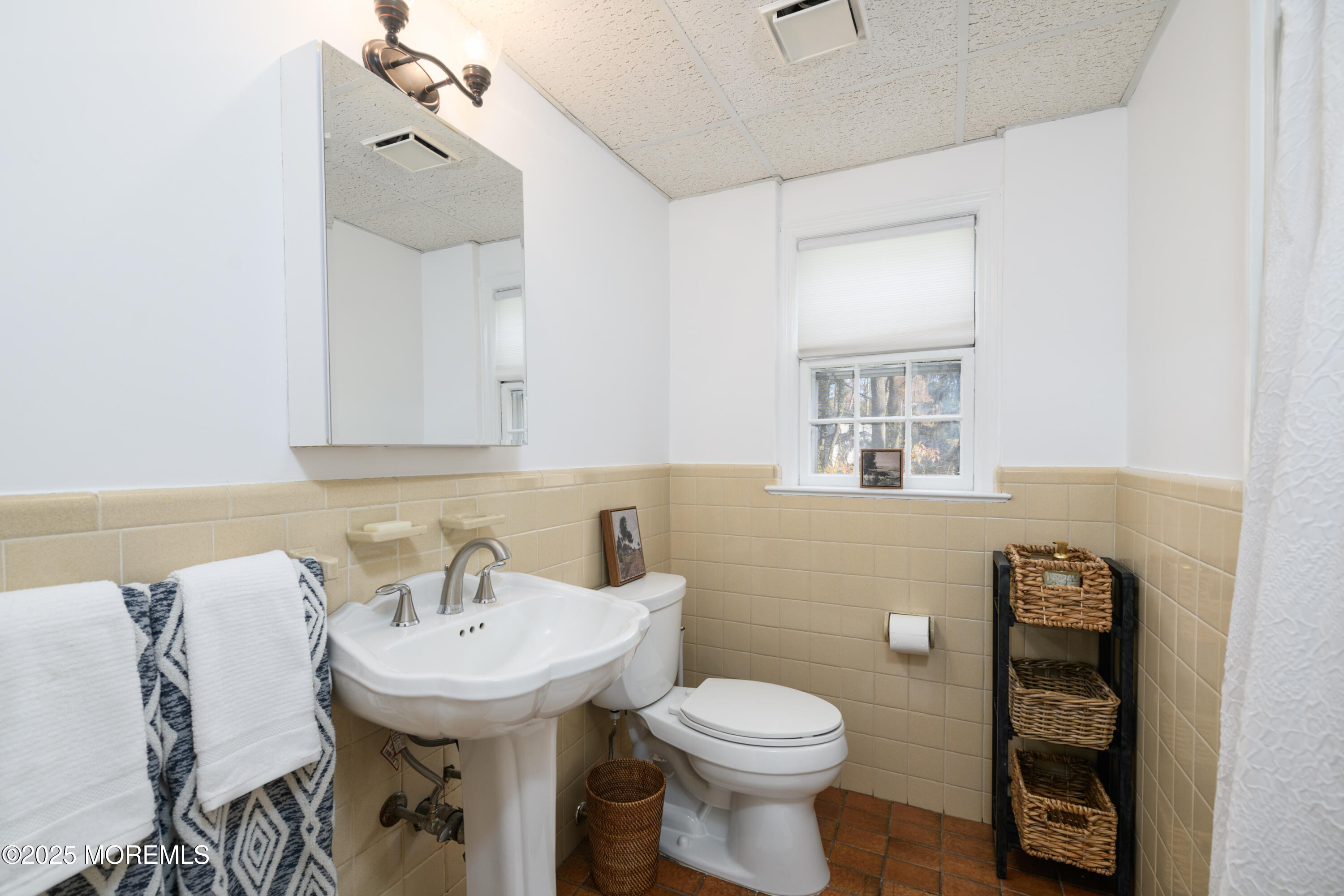 74 Fish Hawk Drive Middletown, NJ 07748 - Photo 19 of 32 a bathroom with a sink a toilet and mirror