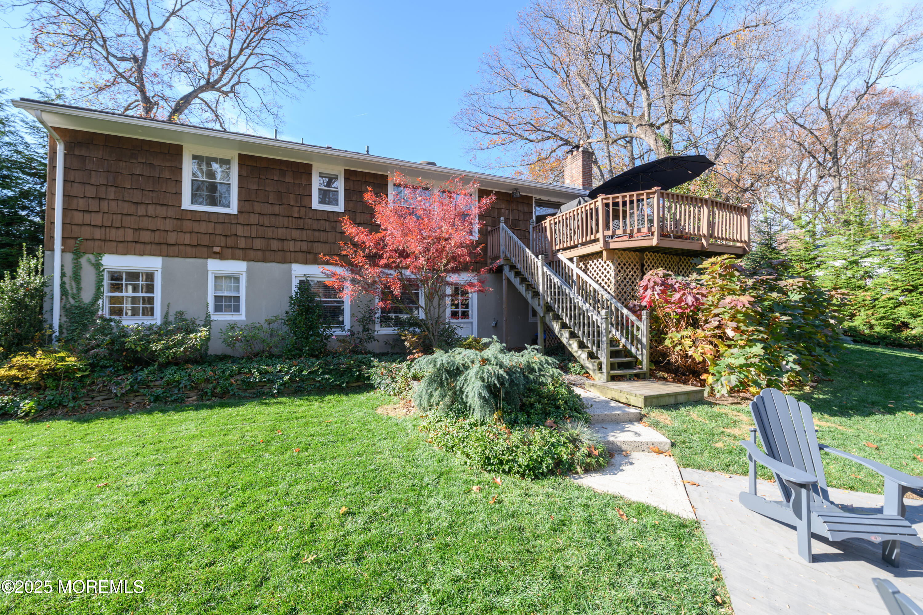74 Fish Hawk Drive Middletown, NJ 07748 - Photo 23 of 32 a front view of a house with garden