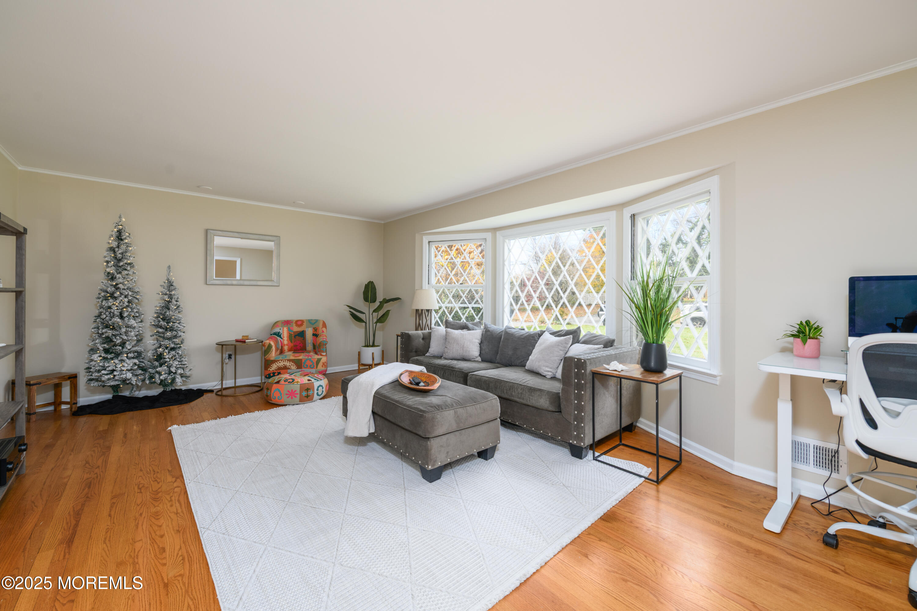 74 Fish Hawk Drive Middletown, NJ 07748 - Photo 4 of 32 a living room with furniture and a flat screen tv