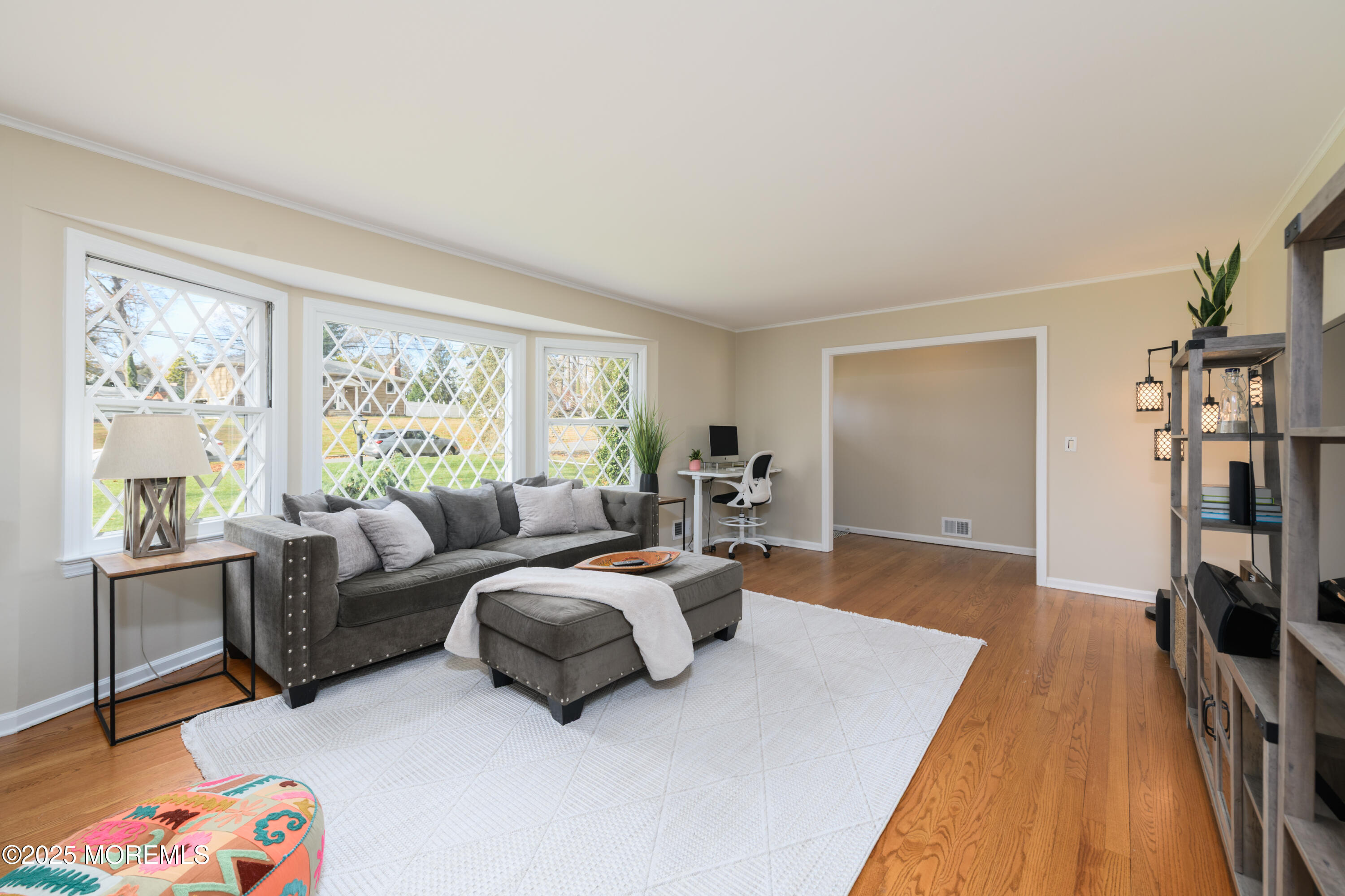 74 Fish Hawk Drive Middletown, NJ 07748 - Photo 5 of 32 a bedroom with furniture and a flat screen tv