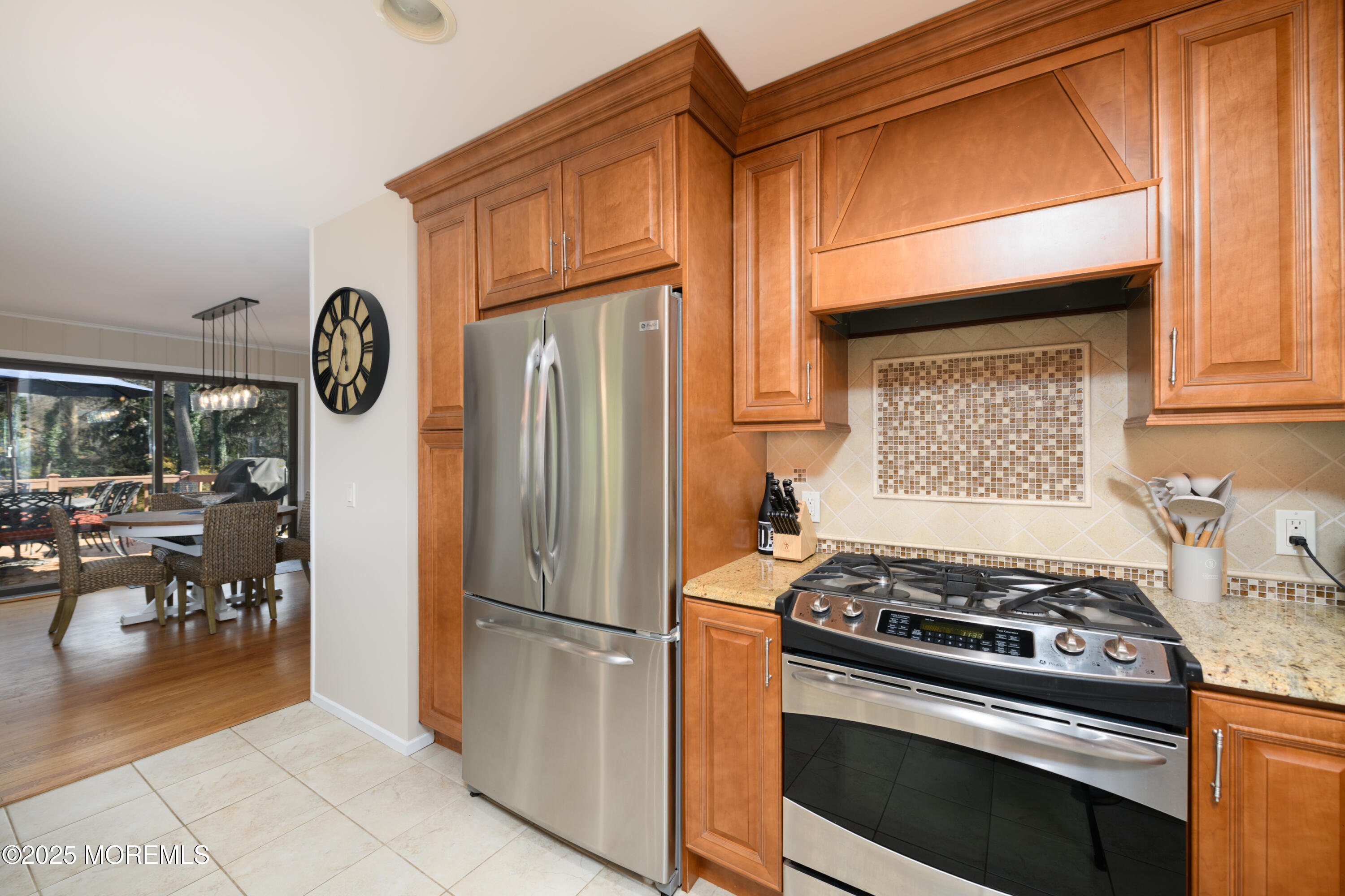 74 Fish Hawk Drive Middletown, NJ 07748 - Photo 9 of 32 a kitchen with a stove and a refrigerator
