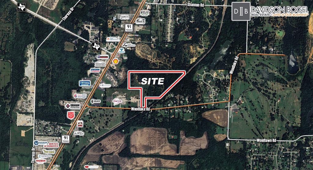 2257 Woodlake Road Denison, TX 75021 - Photo 1 of 4 a picture of street sign