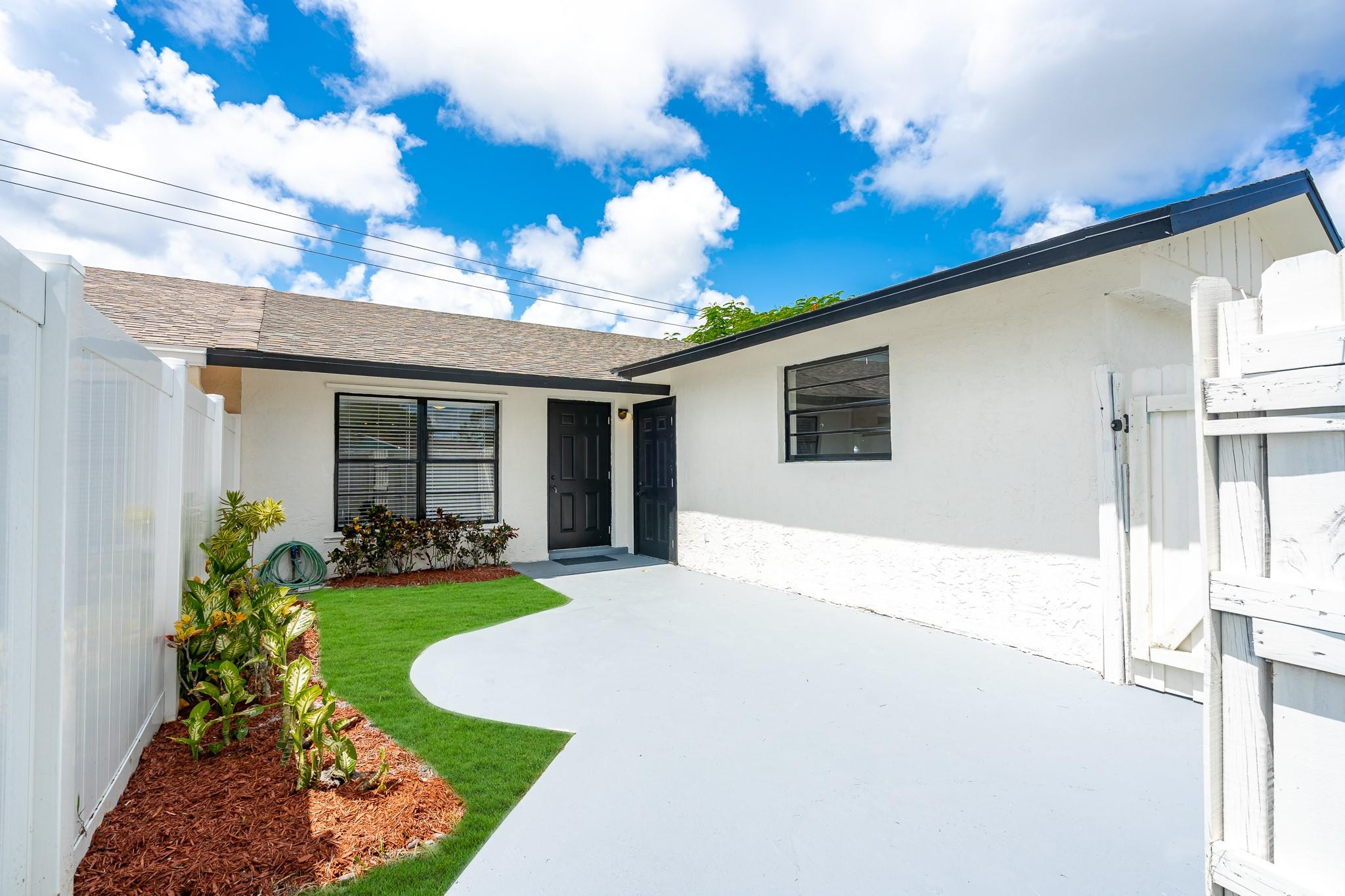4433 Southeast Village Road Stuart, FL 34997 - Photo 1 of 35 Front Courtyard