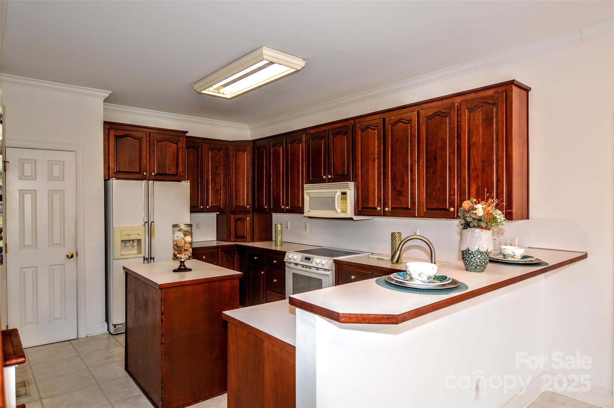 125 Eaglecrest Drive Matthews, NC 28104 - Photo 14 of 28 a kitchen with a sink a stove and refrigerator