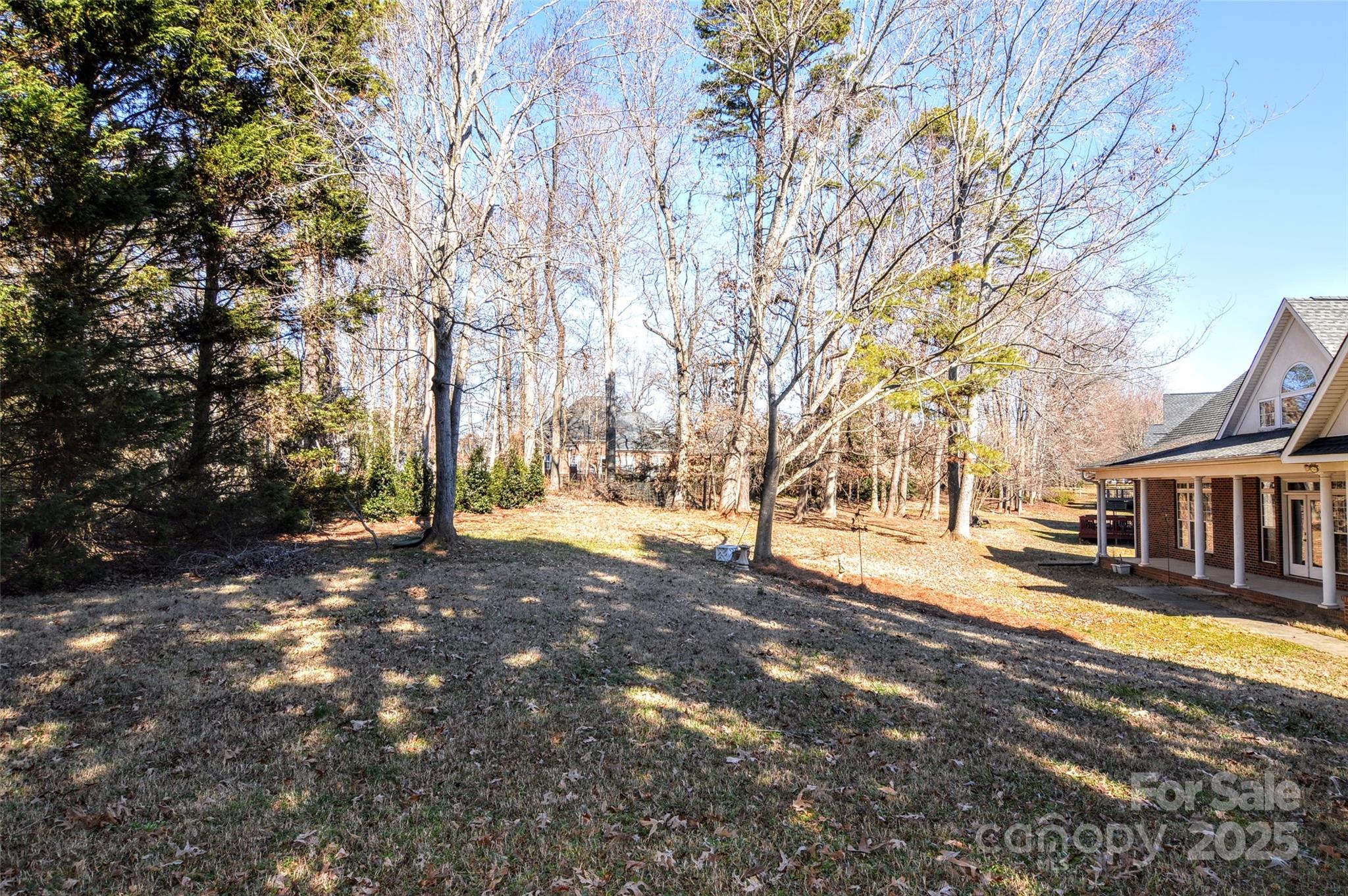 125 Eaglecrest Drive Matthews, NC 28104 - Photo 21 of 28 a view of a yard with a tree