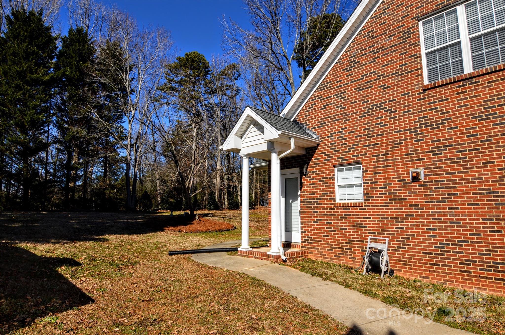 125 Eaglecrest Drive Matthews, NC 28104 - Photo 22 of 28 a front view of a house with a yard