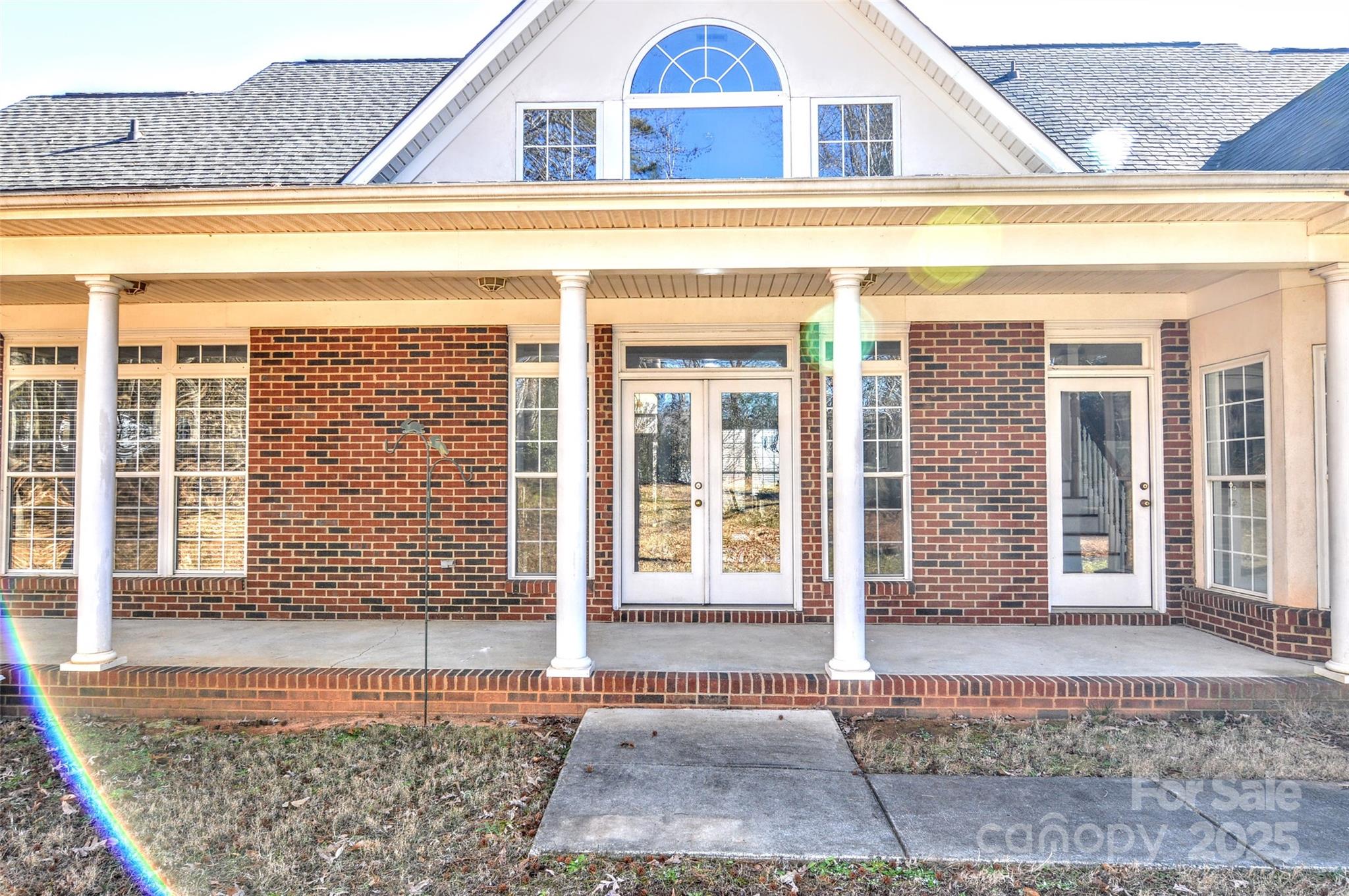 125 Eaglecrest Drive Matthews, NC 28104 - Photo 26 of 28 a view of a brick house with many windows