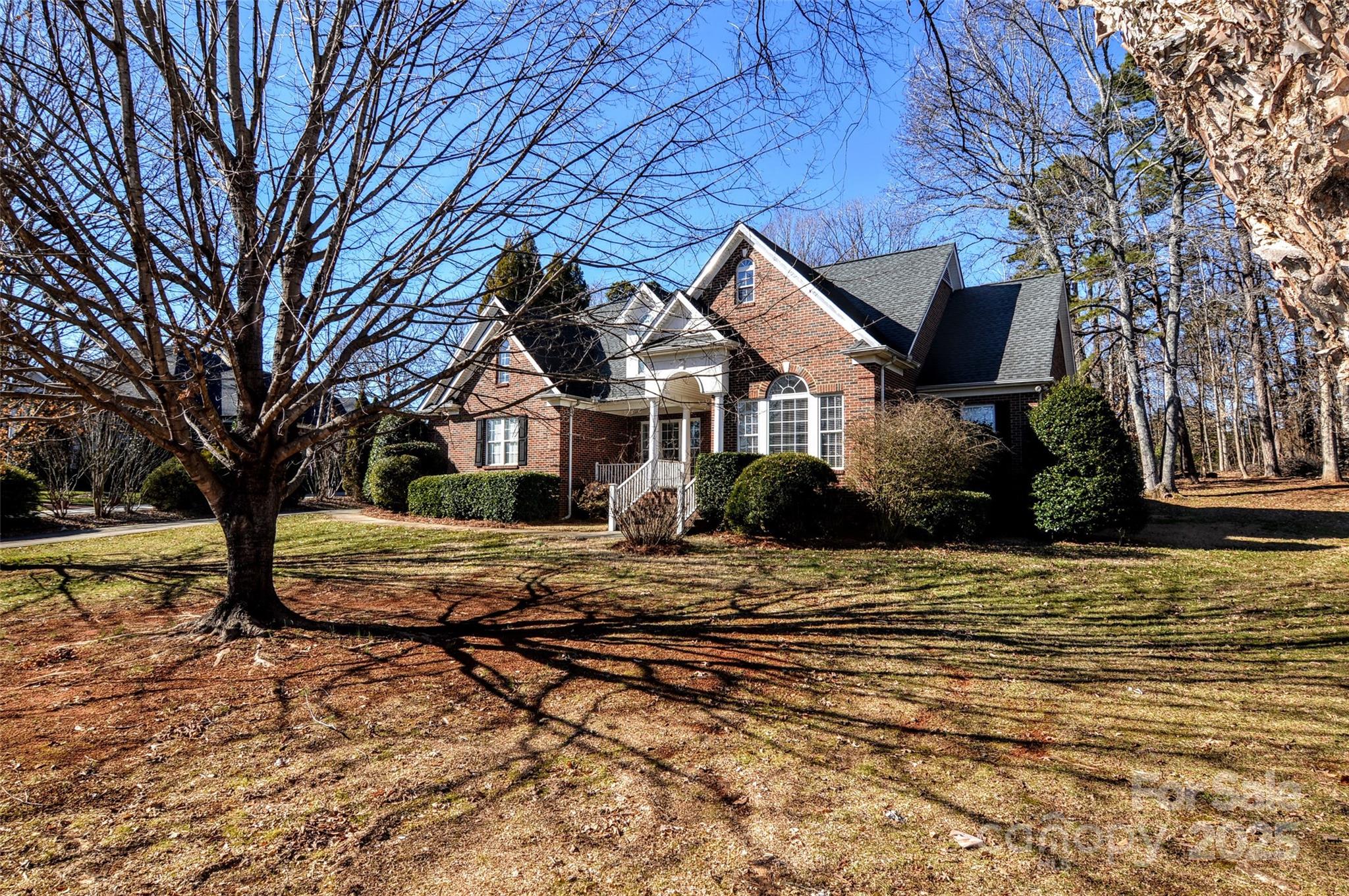 125 Eaglecrest Drive Matthews, NC 28104 - Photo 3 of 28 a front view of a house with a yard