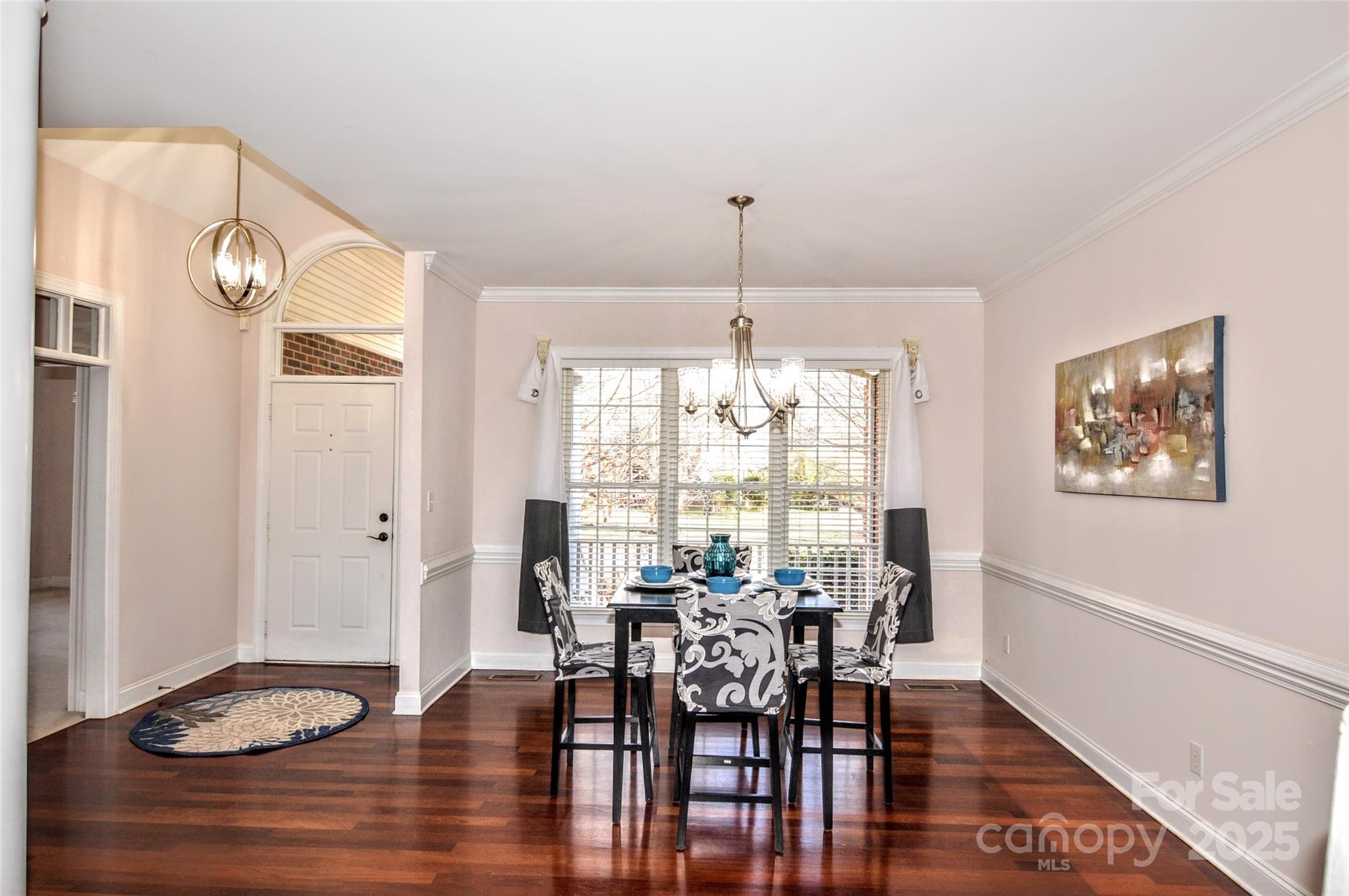 125 Eaglecrest Drive Matthews, NC 28104 - Photo 6 of 28 a view of a dining room with furniture window and wooden floor