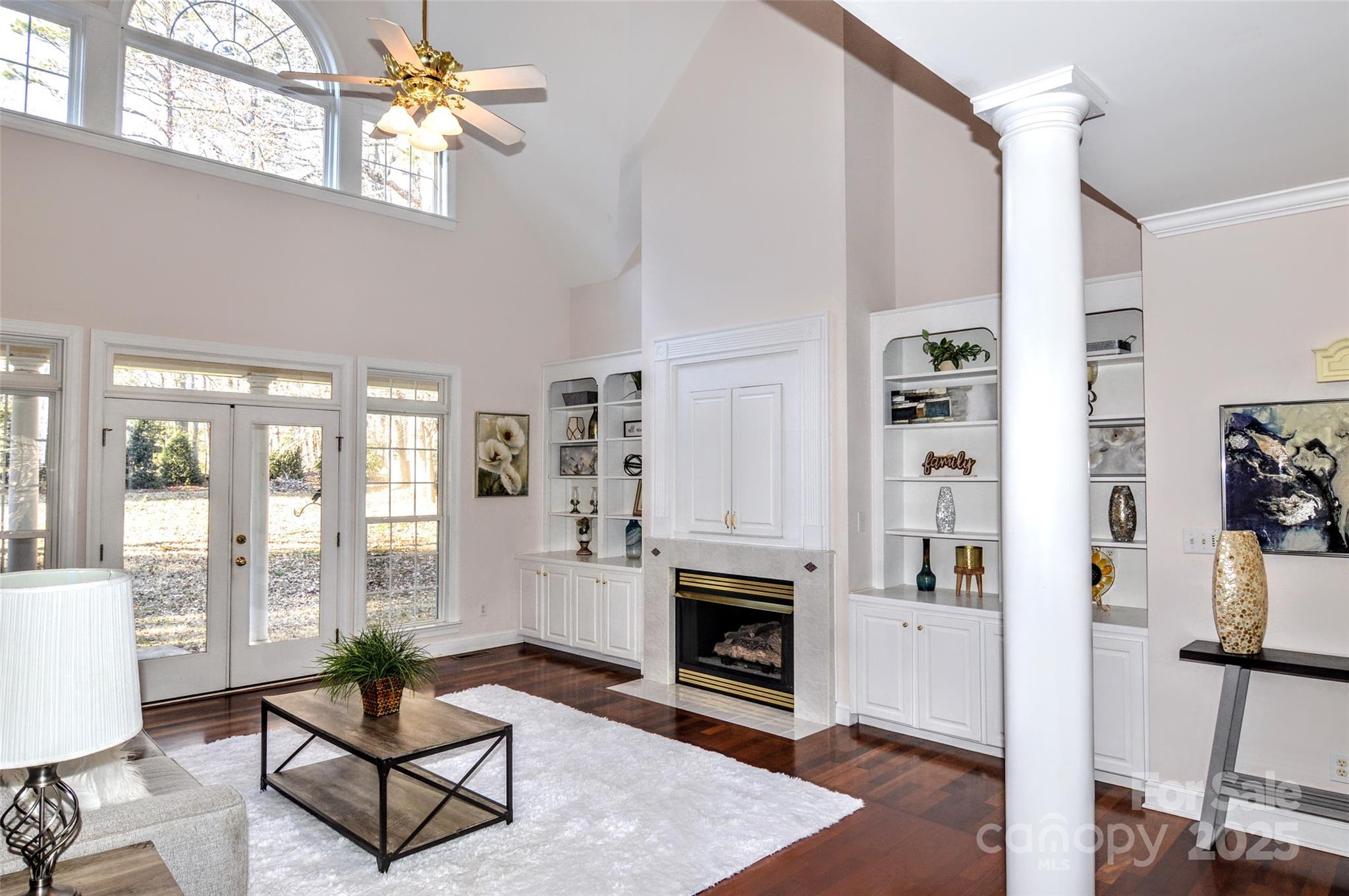125 Eaglecrest Drive Matthews, NC 28104 - Photo 8 of 28 a living room with furniture a fireplace and a table
