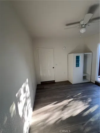 a view of a livingroom with wooden floor